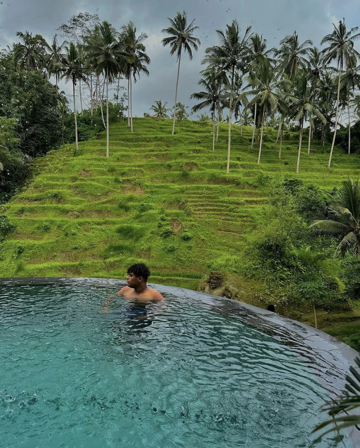 Abdo Salman in a pool with tropical landscape